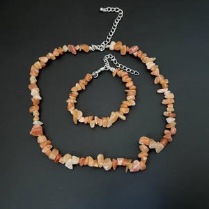 Detail of orange natural stone chip necklace and bracelet set with silver lobster clasp