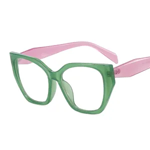 Vintage cat eye glasses featuring translucent green frames and pink temples in a retro style