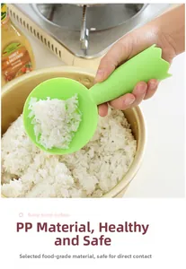 Close-up of green non-stick rice paddle with bump surface and ergonomic PP handle