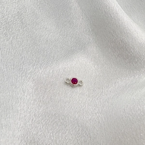 Detail of S925 sterling silver connector with red crystal and dual loops for jewelry DIY