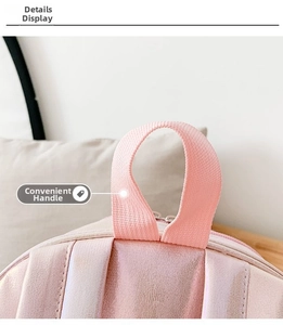 Macro detail of high-density fabric handle on shiny laser pink mermaid backpack