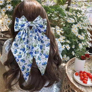 Blueberry print double-layered bow hair clip with long ribbons worn on hair