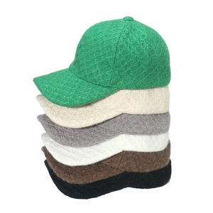 Minimalist knit baseball caps set in six solid colors with textured lattice pattern