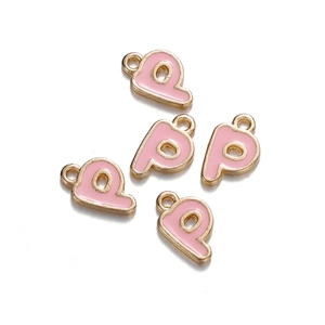 Detailed view of pink enamel alphabet P charms with gold metal edges for DIY jewelry