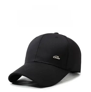 Detailed close-up of a black cotton baseball cap with silver metal SPORT side logo