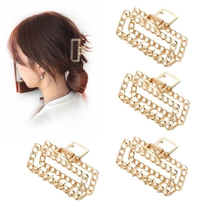 Detail of four gold metal chain hair claws on white background with model hairstyle demo