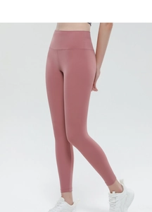 Detail view of high-waisted peach lift yoga pants in dusty rose featuring side seam stitching