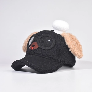 Detail of cute black plush puppy baseball cap with goggles, ears, and chef hat