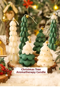 Close-up of green and white Christmas tree candles with gold bells on wooden base