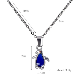 Detailed size chart for penguin pendant necklace with dimensions of 2cm by 1.4cm