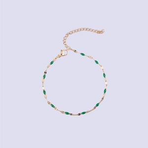 Detail of gold-plated stainless steel lip chain with green enamel beads and lobster clasp