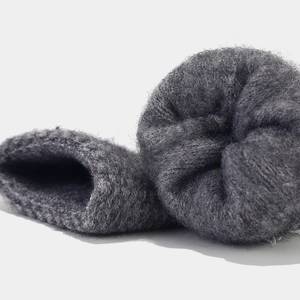 Close-up of thick grey knit fabric with plush thermal lining for winter warmth