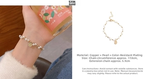 Close-up of gold coin pendant on vintage pearl bracelet with adjustable chain length