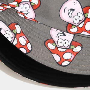 Detailed macro view of dark grey canvas bucket hat with cartoon mushroom and star patterns