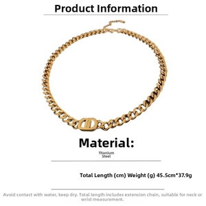 Detail of titanium steel gold chain necklace featuring a vintage CD logo pendant