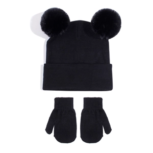 Detail of baby black knit hat with double fur pom-poms and matching warm mittens set