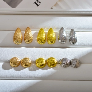Textured teardrop and round stud earrings set in gold, silver, and rose gold finish