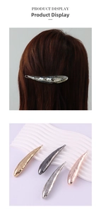 Detail view of irregular molten metal water drop hair clips in four metallic colors