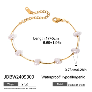 Detail of gold stainless steel pearl bracelet with size dimensions and bow design