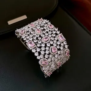 Retro hollow open bangle with pink gemstones and white zircons in silver finish