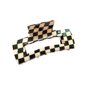Black and white checkerboard rectangle claw clip made of glossy acetate for thick hair