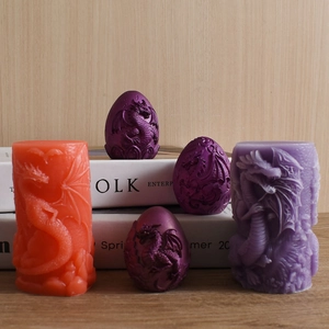 Detailed dragon relief patterns on cylinder and egg-shaped silicone candle molds