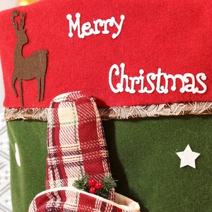 Festive Merry Christmas chair cover featuring 3D Santa doll and red green felt pattern