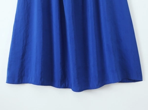 Detail of royal blue summer maxi dress fabric with elegant crinkled texture