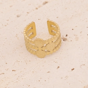 Detail of adjustable gold ring featuring a vintage triple-layer band and textured discs