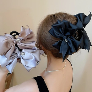 Elegant satin bow hair claw clips with rhinestones for women in black champagne and purple