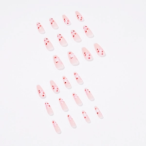 Pink gradient almond press-on nails with layered heart patterns for Valentine's Day