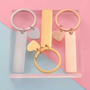 Polished rectangular and heart metal keychains in silver, gold, and rose gold finishes