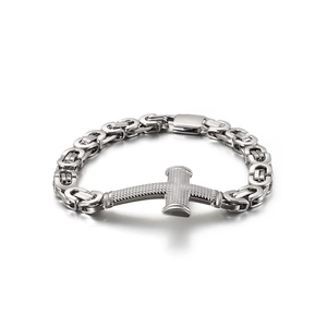 Hip hop style silver cross bracelet for men with woven chain links on white background