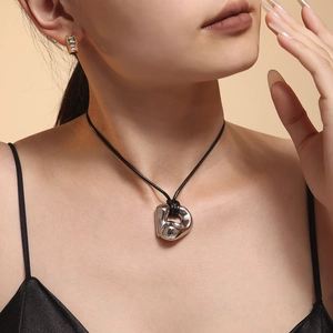 Adjustable black cord necklace with minimalist curved silver titanium steel pendant