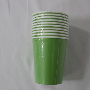 Detail view of stacked green disposable paper cups with white rims in plastic wrap