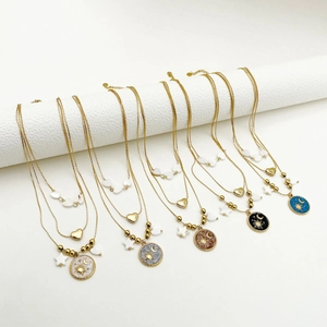 Three-layer star and moon pendant necklace with vintage gold finish and colorful enamel