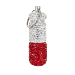 Macro detail of red and silver rhinestone capsule medicine pill box with metal loop