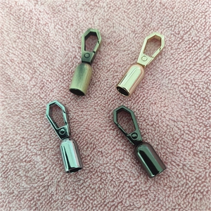 Close-up of metal swivel hooks in bronze, gold, silver and gun black finishes