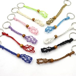 Detailed fan arrangement of colorful handmade woven net keychains with wooden beads