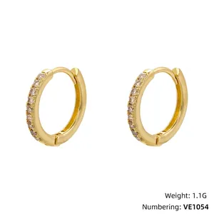 Detailed view of gold hoop earrings with sparkling cubic zirconia inlay and measurements