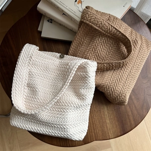 Woven rice-ear texture canvas shoulder bag in cream and camel with magnetic closure