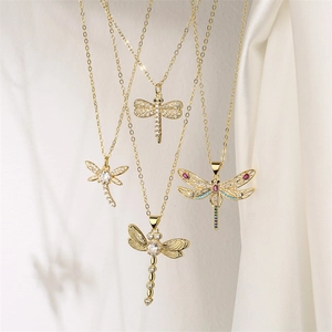 Detail of four golden dragonfly pendants featuring colorful cubic zirconia on fine chains