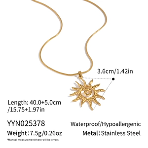 Detail of gold sun pendant necklace with snake chain made of waterproof stainless steel