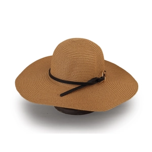 Detail of wide brim straw sun hat with fine weave texture and black decorative belt