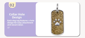 Detail of rectangular dog tag with golden glitter finish and silver paw print charm