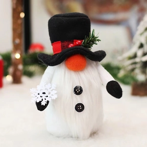 Christmas gnome plush decoration with black hat and white faux fur in a festive setting