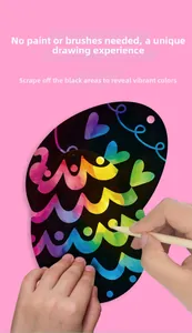 Close-up of rainbow scratch art egg kit with wooden stylus and colorful DIY patterns