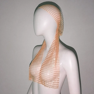 Detail of crystal rhinestones on elastic fishnet headband with sparkling finish