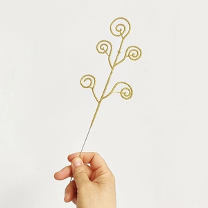 Detail of Christmas glitter candy cane branches with five golden spiral picks for party decor