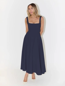 Deep blue A-line maxi dress with square neckline and wide shoulder straps on model